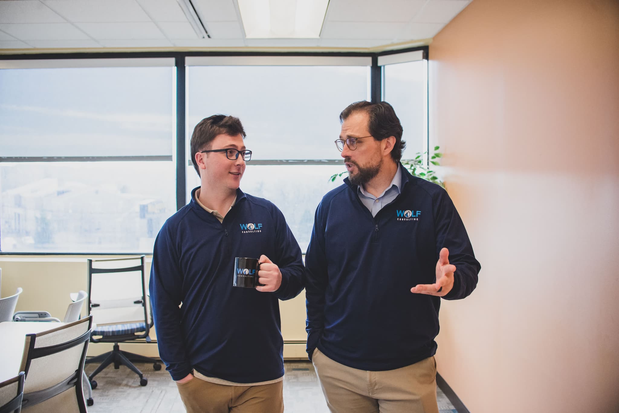 Two Wolf Consulting engineers talking in the Pittsburgh office