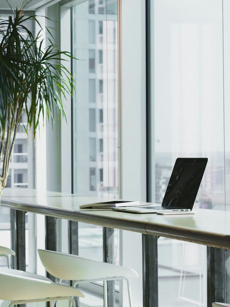 Modern office workspace with a laptop, representing Microsoft 365 productivity