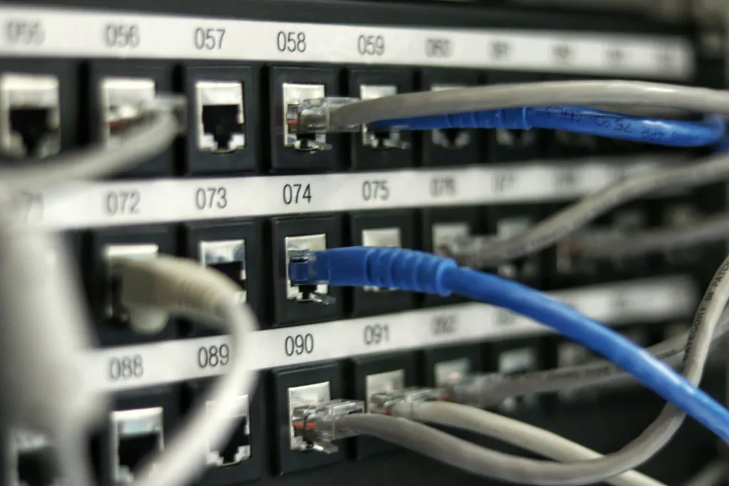 Network patch panel with Ethernet cabling representing secure network access