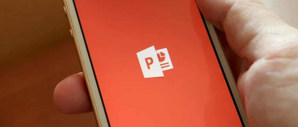phone in palm of hand showing powerpoint logo on screen