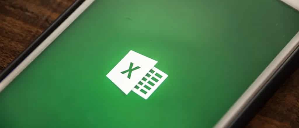 phone on desk showing Microsoft Excel logo on screen