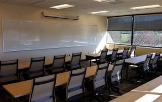 Business showing training room with chairs and white board