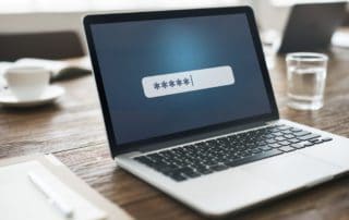 laptop screen showing hidden password as users logs in